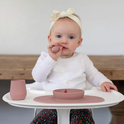 What are the developmental milestones for feeding?